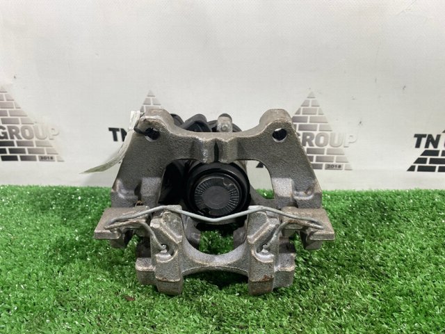 Суппорт тормозной левый задний 8V0615423D VAG