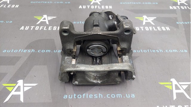 1738988 FORD Суппорт задний левый купить в Житомир