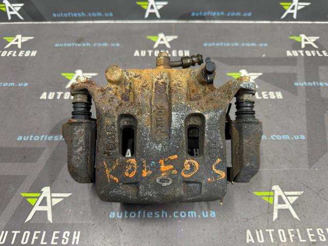 Суппорт тормозной, передний, левый 41011CC00A NISSAN