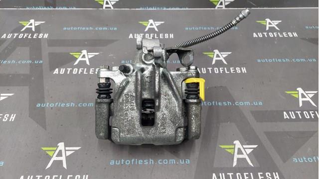 Тормозной суппорт задний левый 7701056166 RENAULT