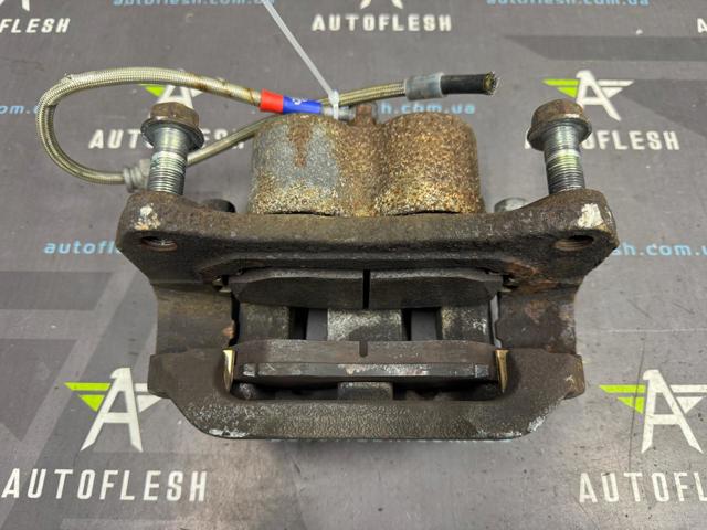 L2063371X MAZDA Суппорт тормозной передний левый купить в Чернигов