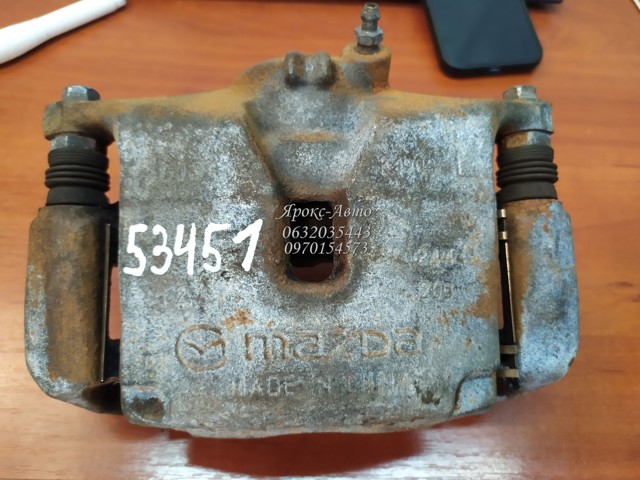 B4Y03399ZB MAZDA Суппорт тормозной передний левый купить в Харьков