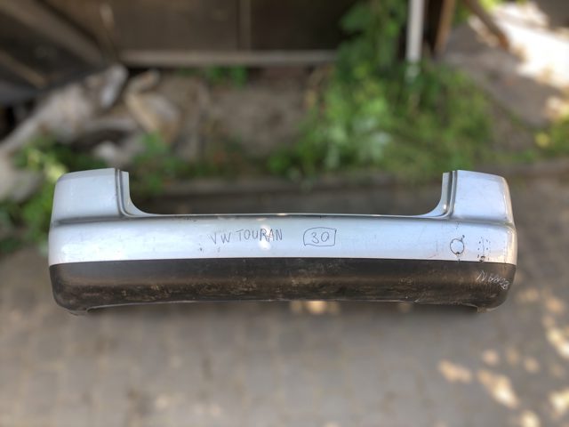 Задний бампер 1T0807421 VAG