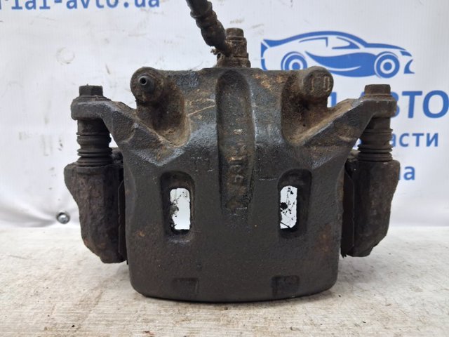 Суппорт тормозной, передний, левый 41011EB32A NISSAN