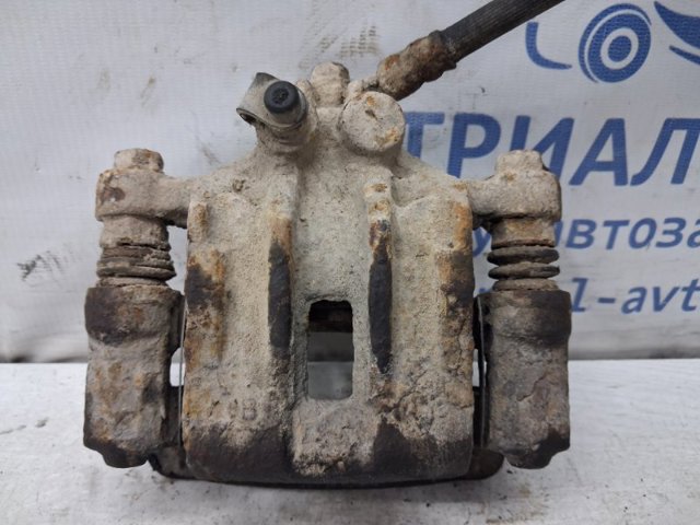 Суппорт тормозной левый задний 582101H300 HYUNDAI