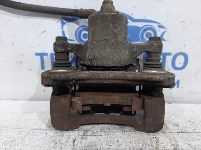 Суппорт тормозной левый задний 582102Y300 HYUNDAI