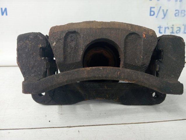 Задний левый суппорт 582103E000 HYUNDAI