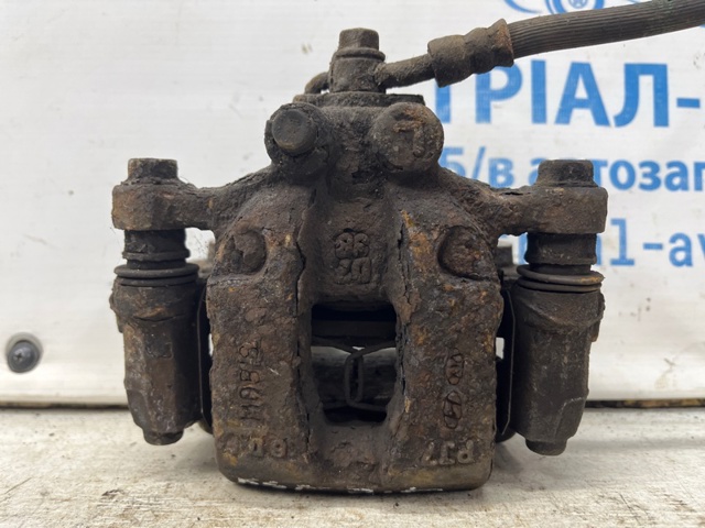 Задний левый суппорт 58210D7000 HYUNDAI