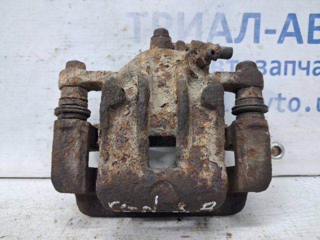 Тормозной суппорт правый задний 582303K050 HYUNDAI