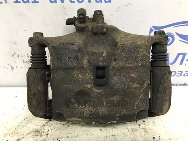 Суппорт тормозной передний правый B4Y73398ZB MAZDA