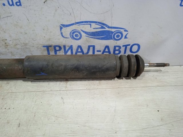 Стойка амортизатора задняя E62101KA1B NISSAN
