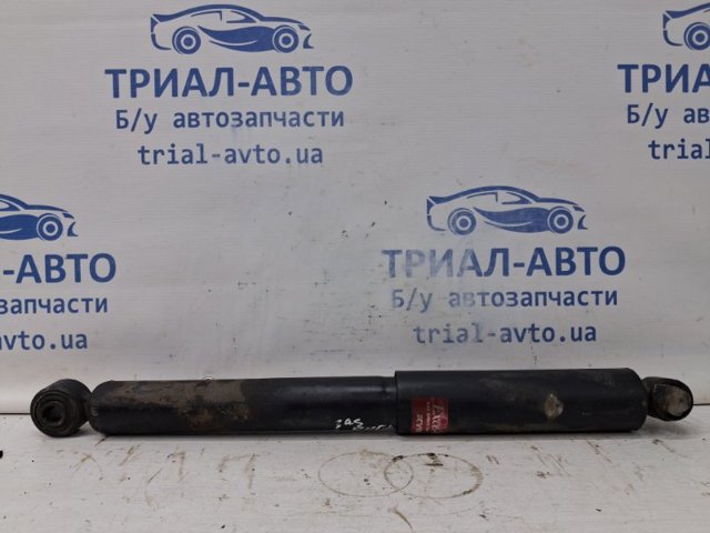 Стойка амортизатора задняя Митсубиси Паджеро SPORT I