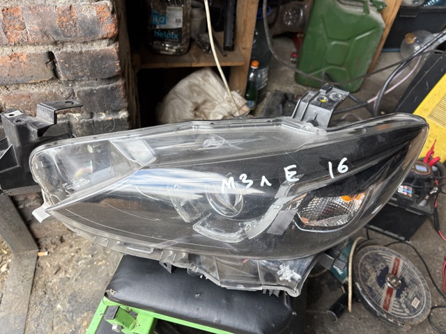 Фара основная левая GMG551041E MAZDA
