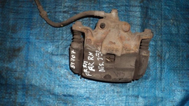 NISSAN 41001JN00A Суппорт тормозной передний правый в наличии Житомир