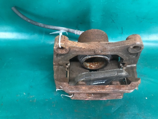 41011CG000 NISSAN Суппорт тормозной передний левый купить в Тернополь