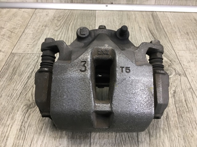 41011CG000 NISSAN Суппорт тормозной передний левый купить в Тернополь
