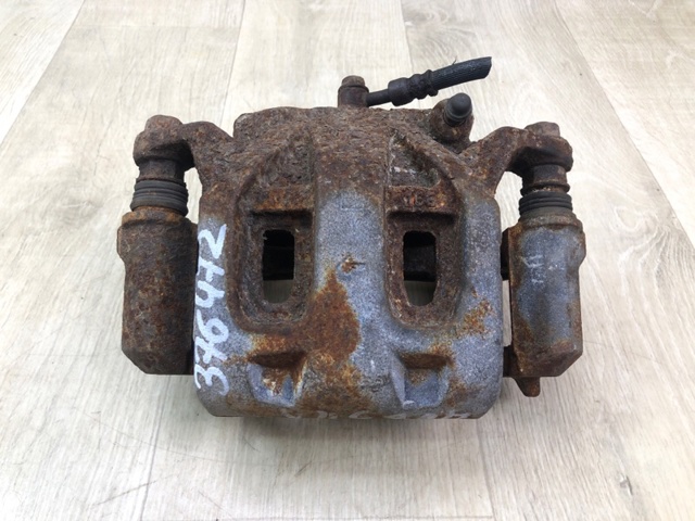 Суппорт тормозной передний левый 41011EJ20A NISSAN