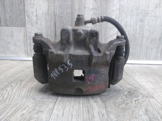 Суппорт тормозной, передний, левый 41011EN00B NISSAN