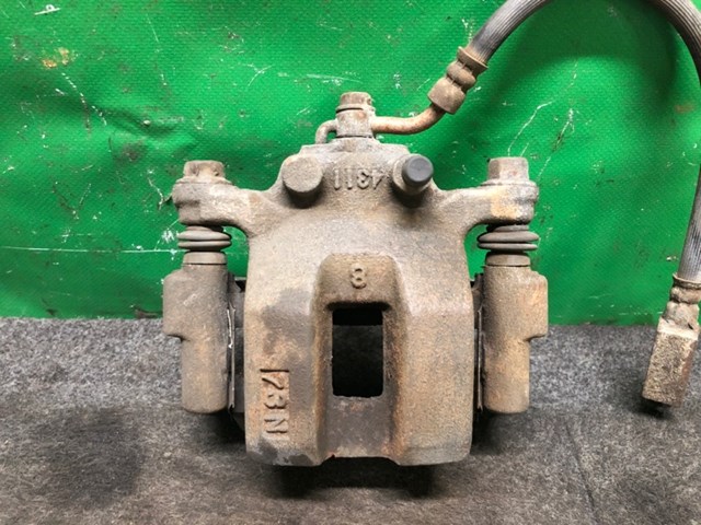 Суппорт тормозной левый задний 44011CL70B NISSAN