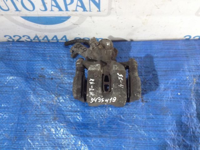 Задний левый суппорт 5540280J00999 SUZUKI