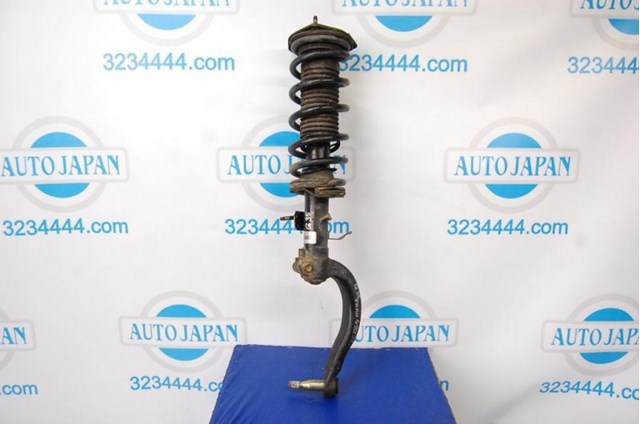 Амортизатор подвески передний левый 56110AC525 NISSAN