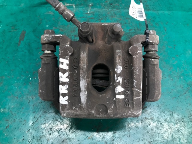 Суппорт тормозной задний правый 582300W000 HYUNDAI