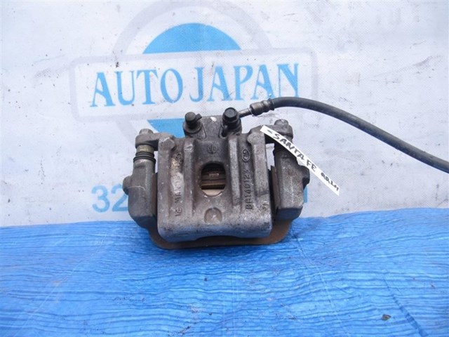 Тормозной суппорт задний левый 583102WA01 HYUNDAI