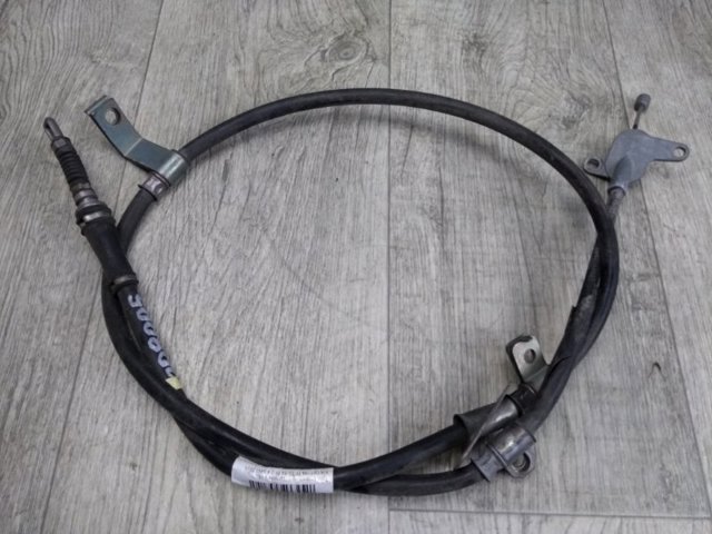 Трос ручного тормоза задний 597603Q300 HYUNDAI