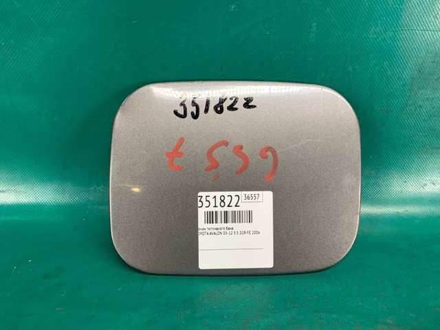 Лючок (дверца) бензобака 77350AC021 TOYOTA