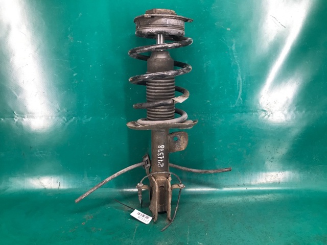 Амортизатор подвески передний левый E43033LM0B NISSAN