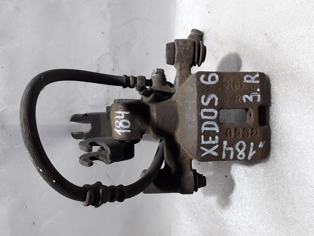 Тормозной суппорт правый задний GA2E2661XA MAZDA