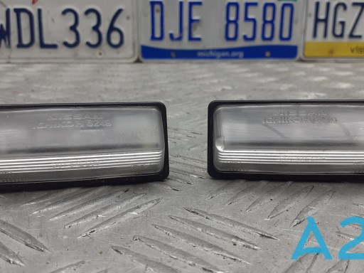 Фонарь подсветки заднего номера 265108991B NISSAN