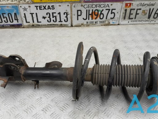 Амортизатор подвески передний правый E43023JV0B NISSAN