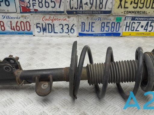 Амортизатор подвески передний левый E43033JV0B NISSAN