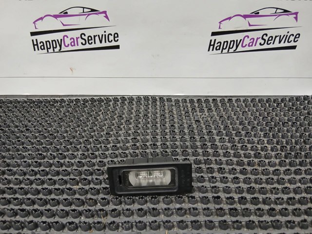 Фонарь подсветки заднего номера 4G0943021 VAG