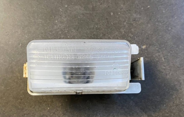 26510EL000 NISSAN Фонарь подсветки заднего номерного знака купить в Днепр