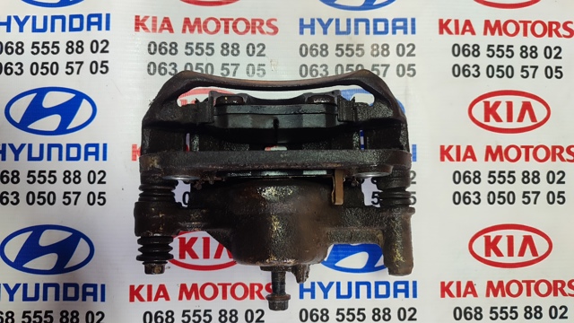 Суппорт тормозной передний левый 581101J600 HYUNDAI
