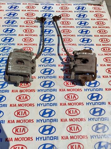 Тормозной суппорт задний левый 582102W000 HYUNDAI