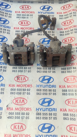 Суппорт тормозной левый задний 582103Q100 HYUNDAI