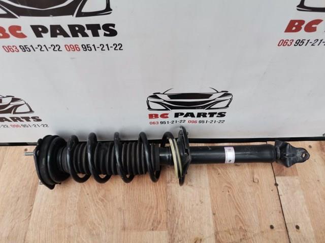 Стойка амортизатора задняя 562104GA0D NISSAN