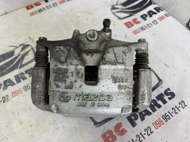 Суппорт тормозной, передний, левый BCYA3399ZB MAZDA