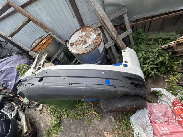 Бампер задний TK4850221 MAZDA