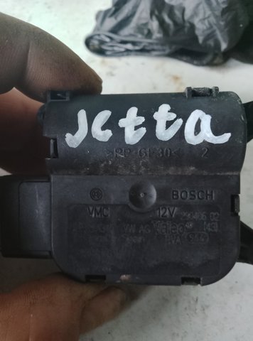 Двигун заслінки печі