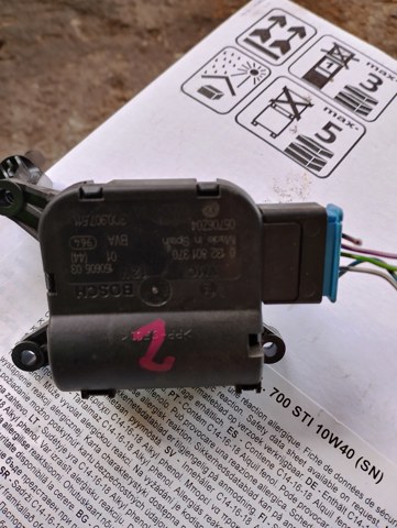 Двигун заслінки печі