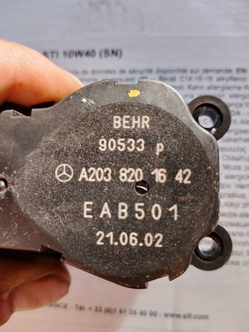 Двигун заслінки печі