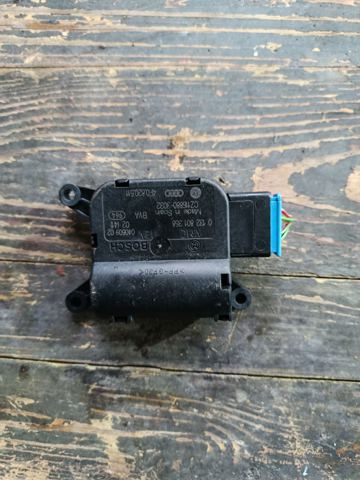 Двигун заслінки печі