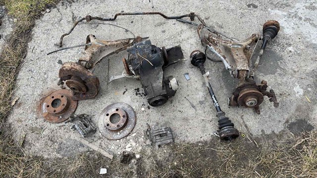 Рычаг задней подвески нижний левый