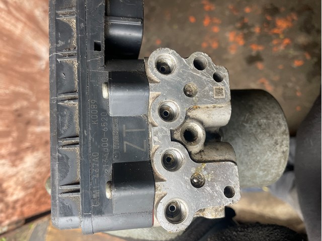 Блок управления ABS GMM1437A0 MAZDA