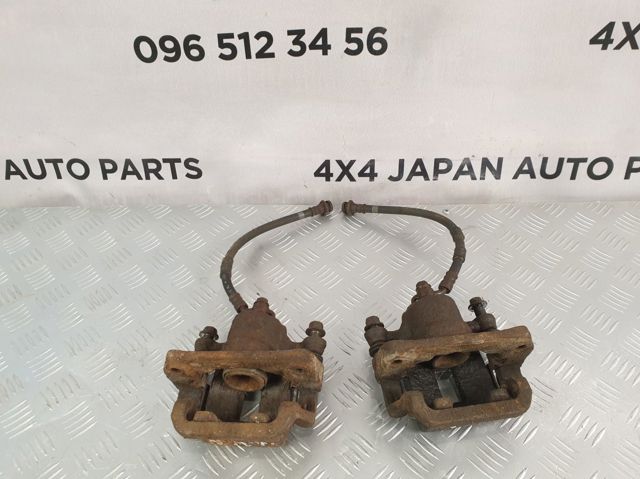 Суппорт тормозной левый задний 44011CB10A NISSAN