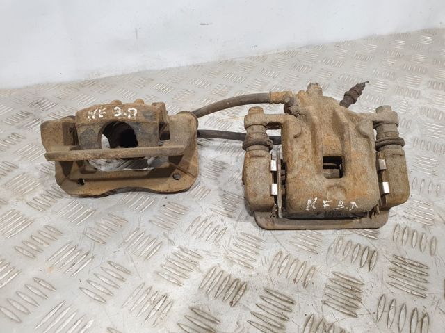 Задний правый суппорт 582303K150 HYUNDAI